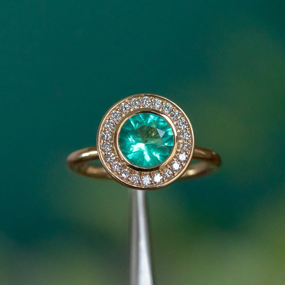 0.94ct Round Neon Green Emerald With Bezel Set Diamond Halo In 18k Yellow Gold