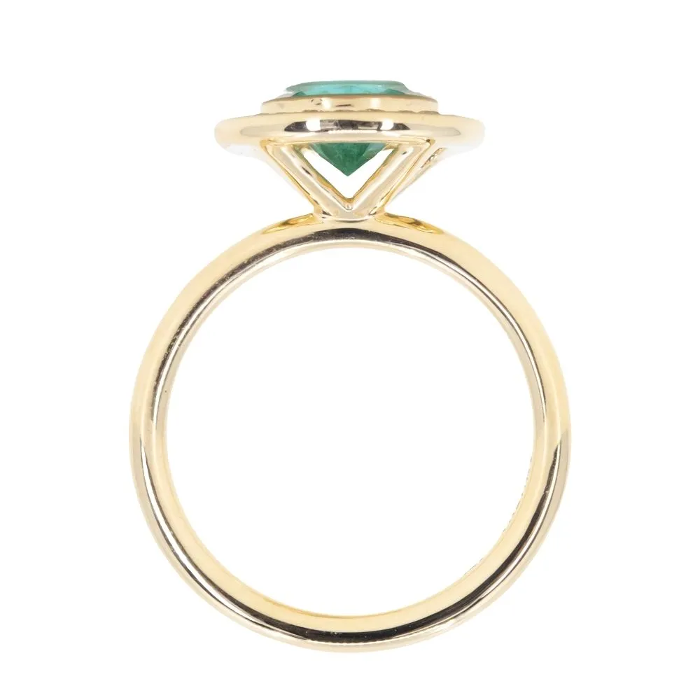 0.94ct Round Neon Green Emerald With Bezel Set Diamond Halo In 18k Yellow Gold