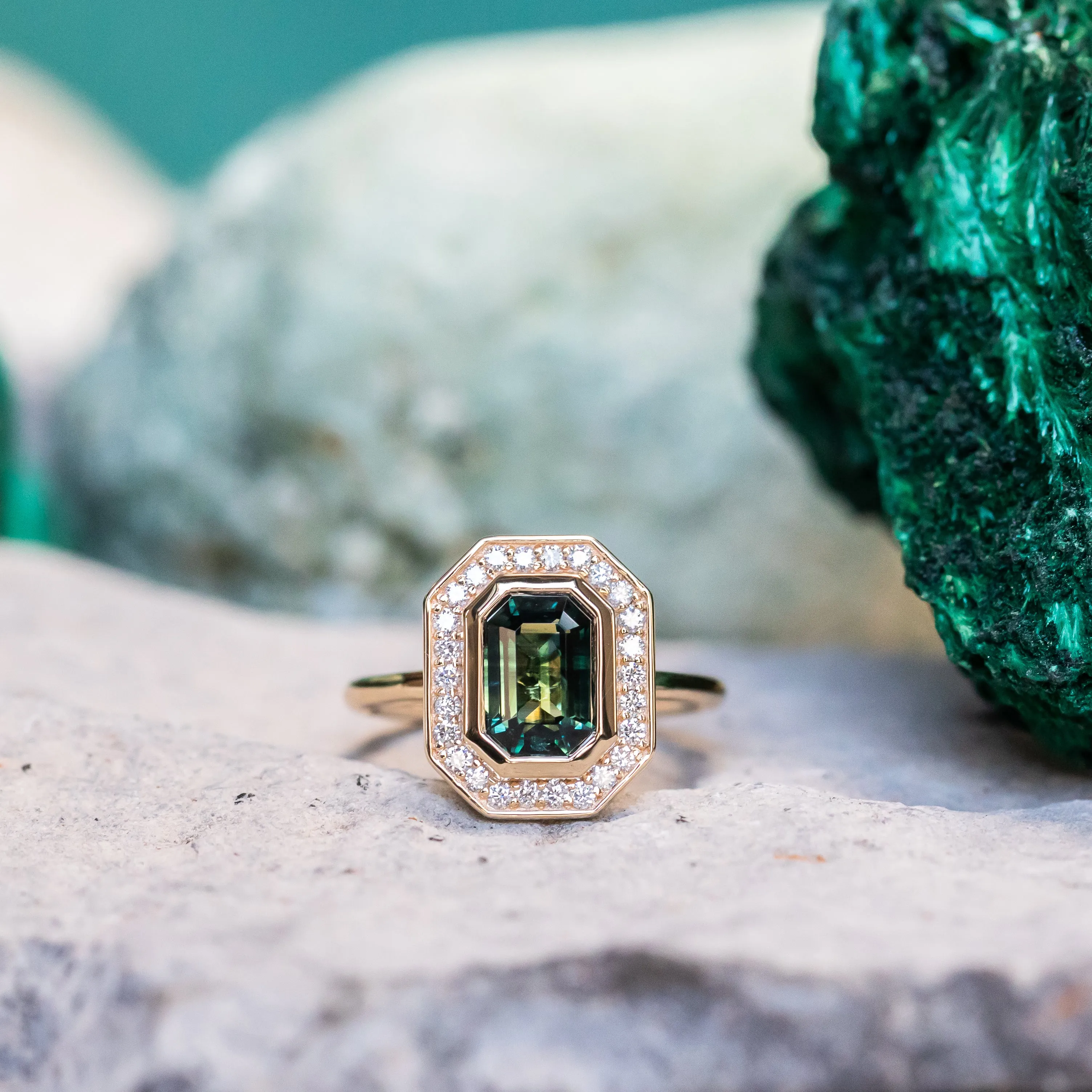 2.05ct Emerald cut Sapphire With Bezel Set Diamond Halo In 14k Yellow Gold