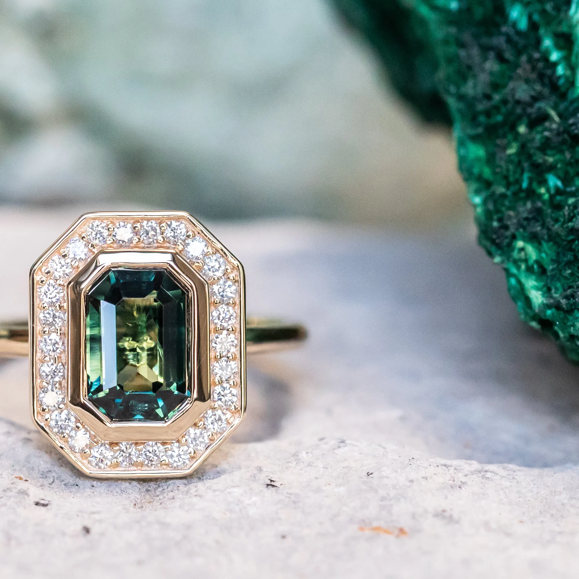 2.05ct Emerald cut Sapphire With Bezel Set Diamond Halo In 14k Yellow Gold