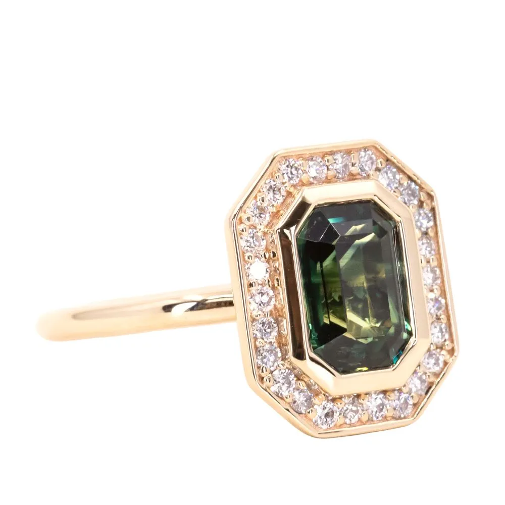 2.05ct Emerald cut Sapphire With Bezel Set Diamond Halo In 14k Yellow Gold