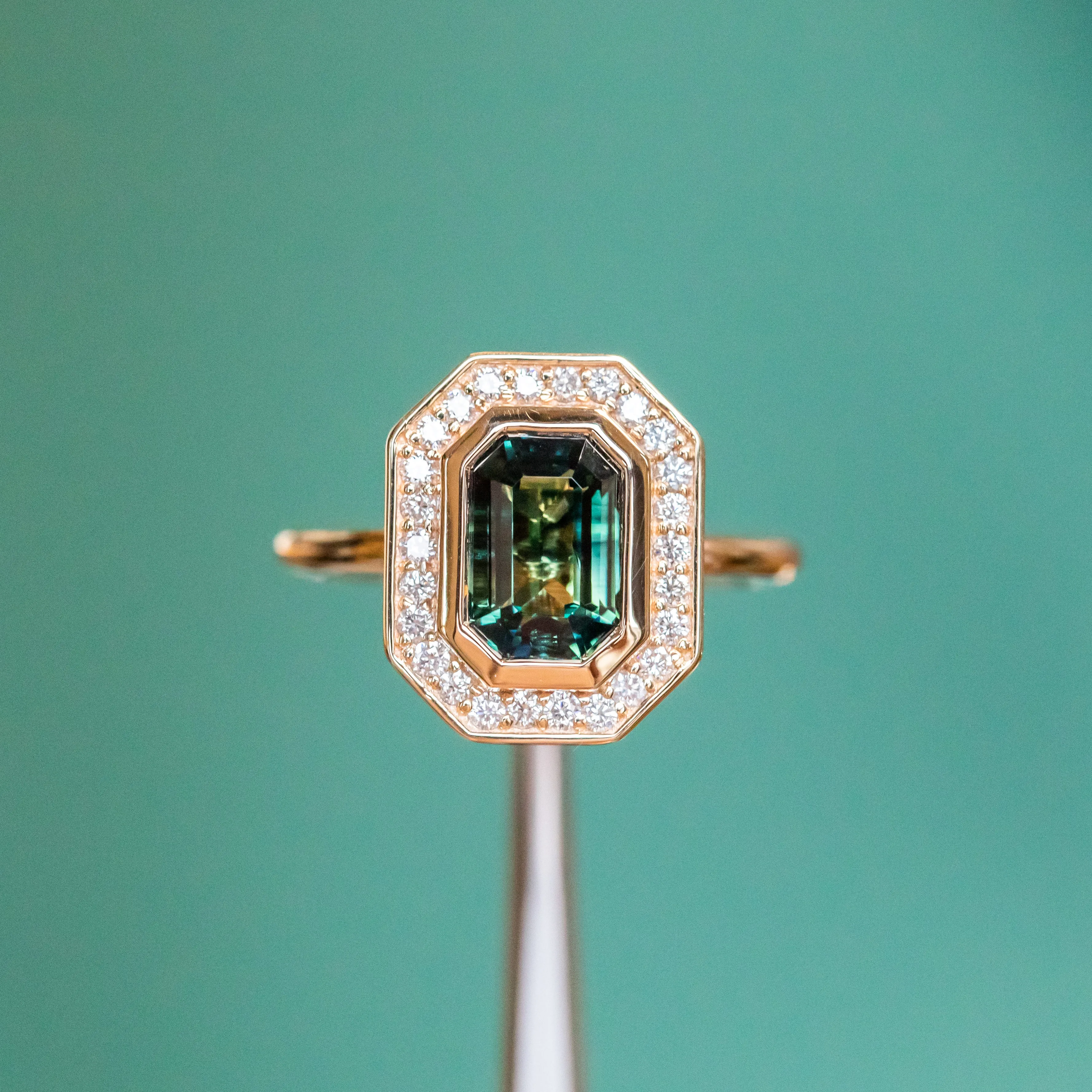 2.05ct Emerald cut Sapphire With Bezel Set Diamond Halo In 14k Yellow Gold